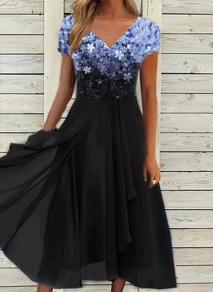 Black dress with blue sequin top against a wooden background
