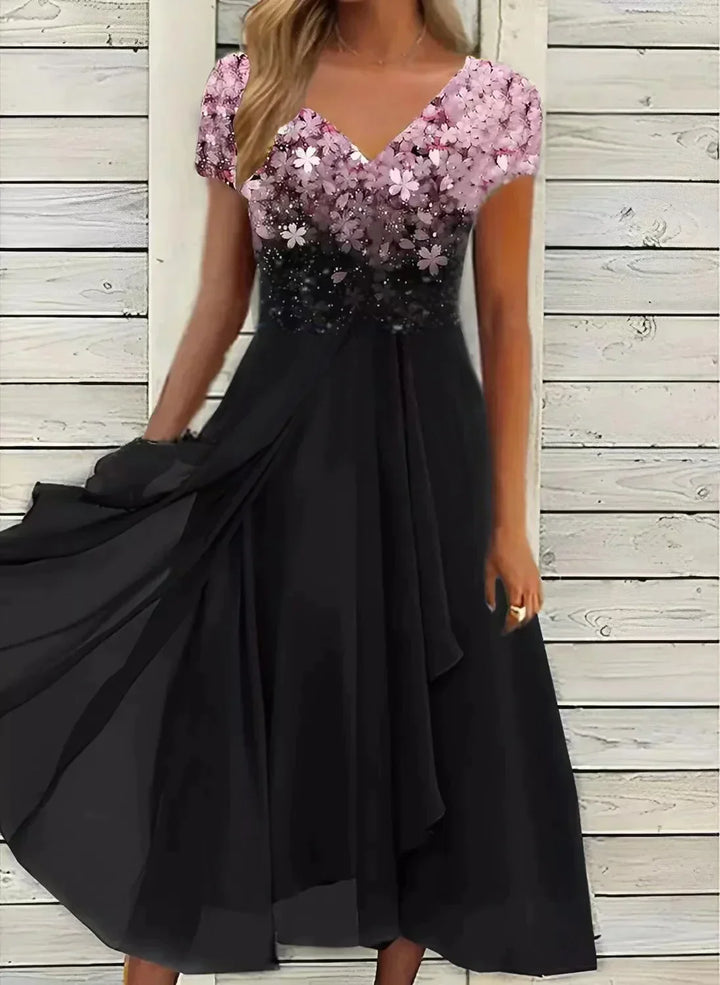 Black and pink dress with sequin top against a wooden background
