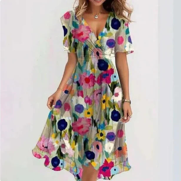 Colorful floral dress worn by a person on a white background